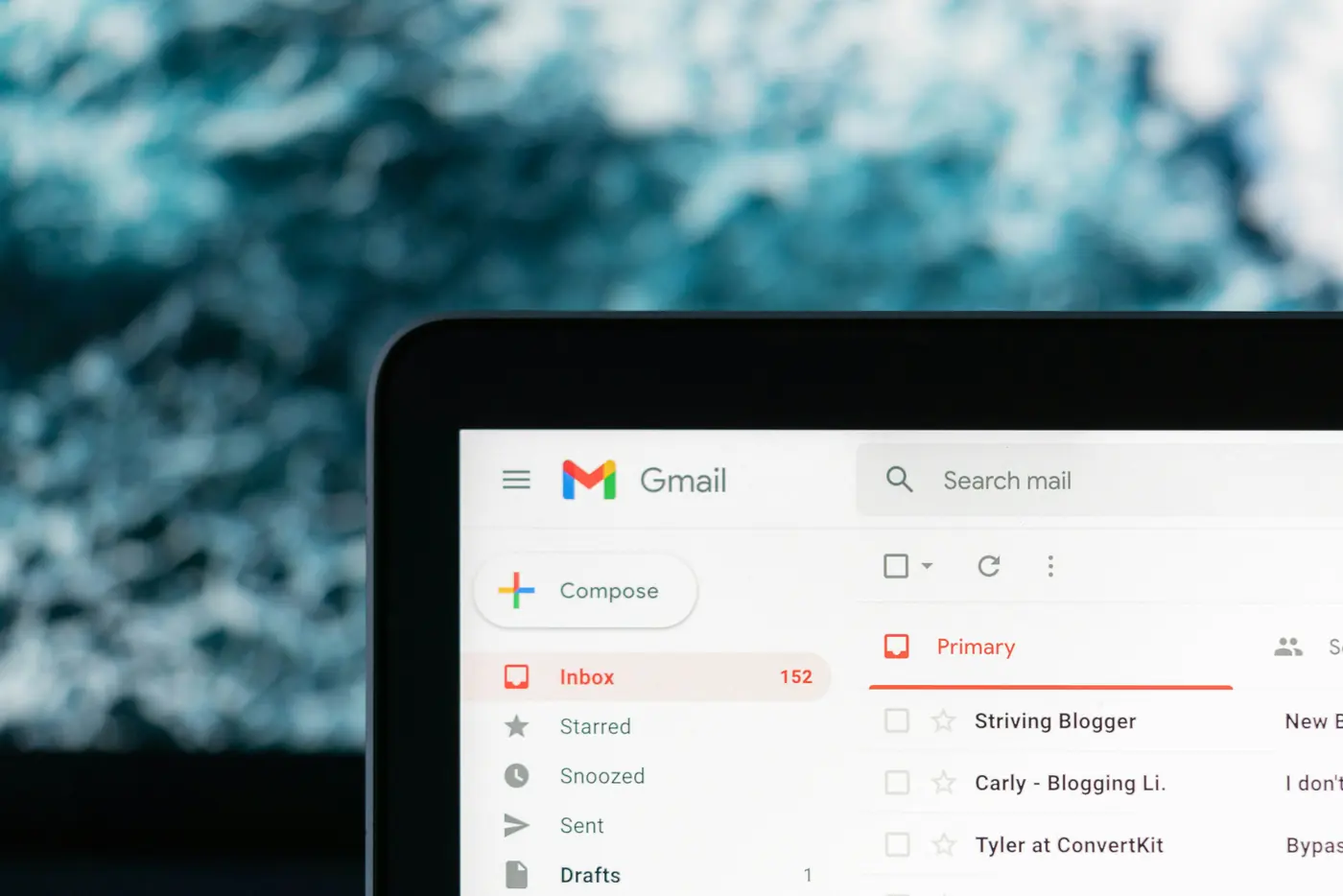 A Gmail inbox open on a laptop, showing a list of marketing newsletters