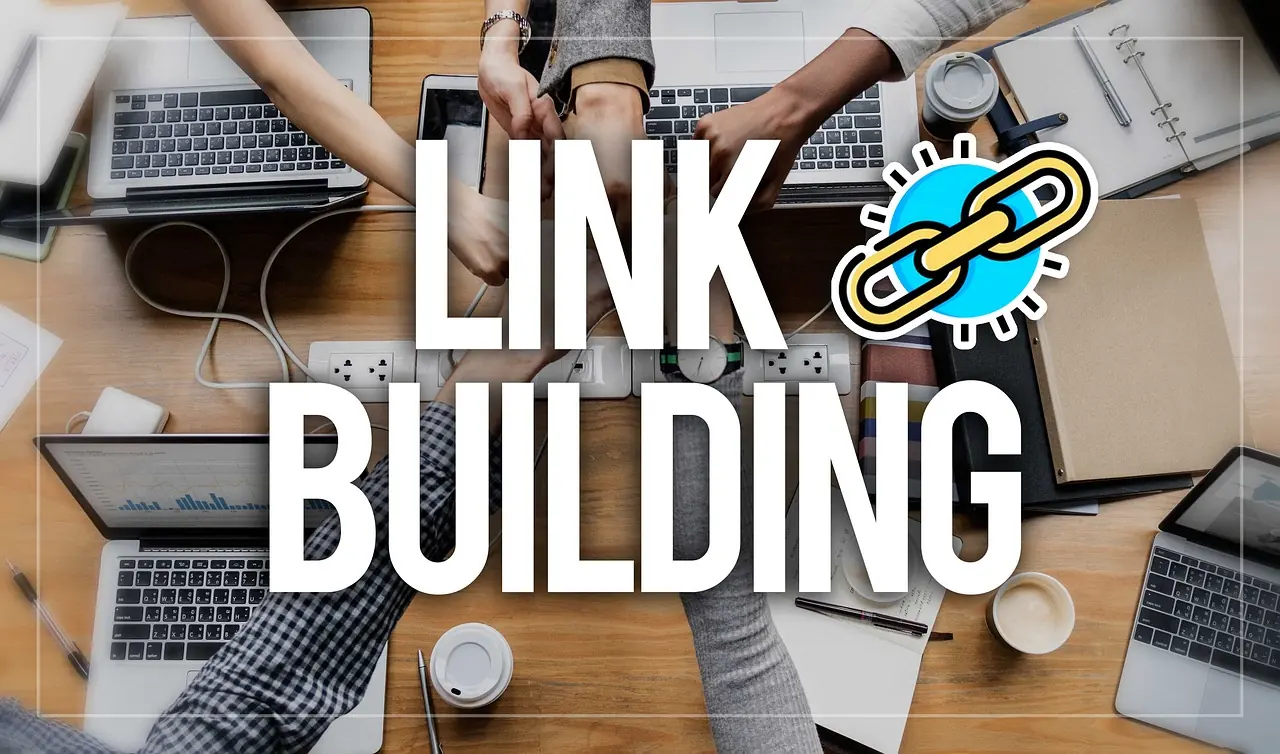 A desk seen from above with the words “link building” set across it