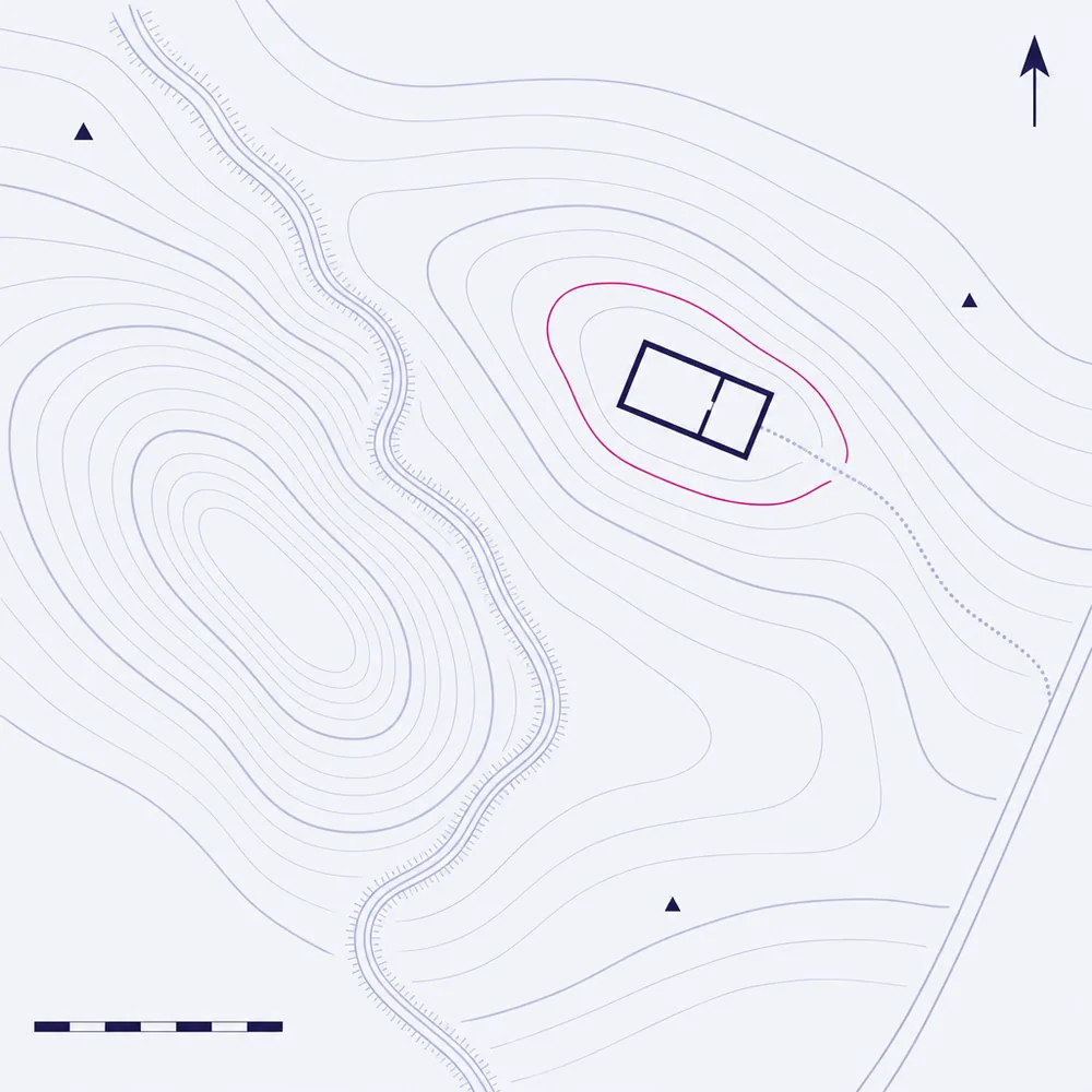 A site contour plan: contours nesting around low ground with a watercourse running through it, and a building footprint up on the higher ground